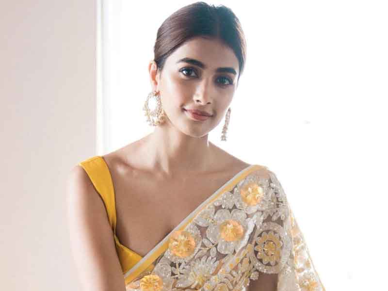 Pooja Hegde sizzles in shiny yellow saree